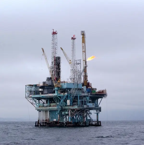 Oil rig at sea with flare stack